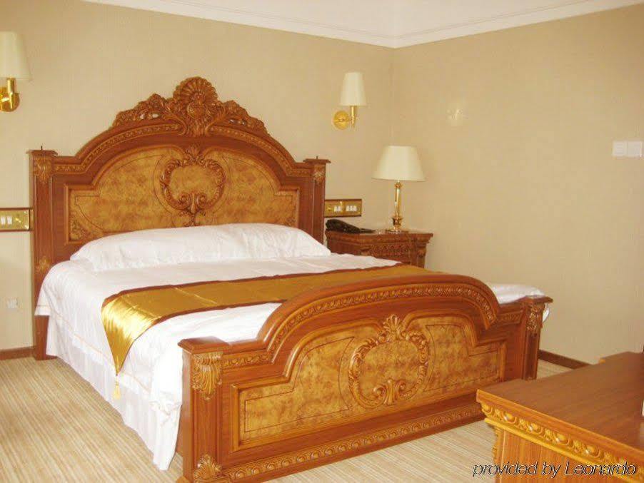 Golden Zone Hotel Jinghong Room photo